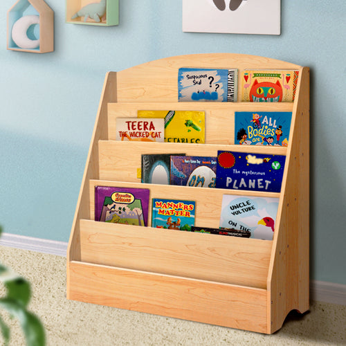 Wooden bookshelf with children's books against a light blue wall.