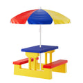 Colorful children's picnic table with benches and umbrella on a white background